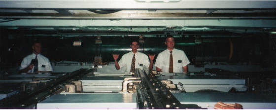 welker__roberts__and_i_in_the_torpedo_bay_of_an_active_neclear_sub_with_torpedo_behind_us.jpg